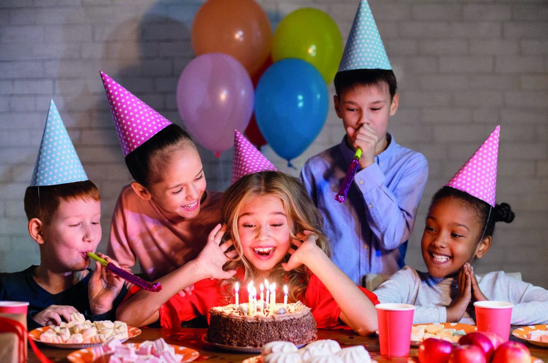 Kids,Looking,At,Birthday,Cake,With,Candles,,Having,B-day,Party